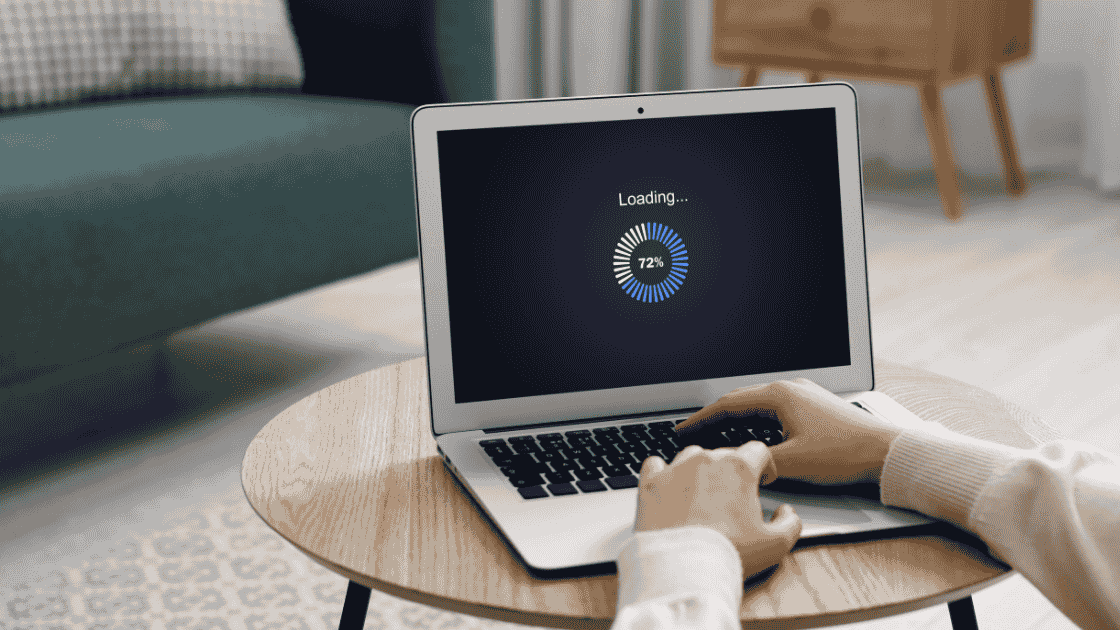 Office worker on laptop with loading screen