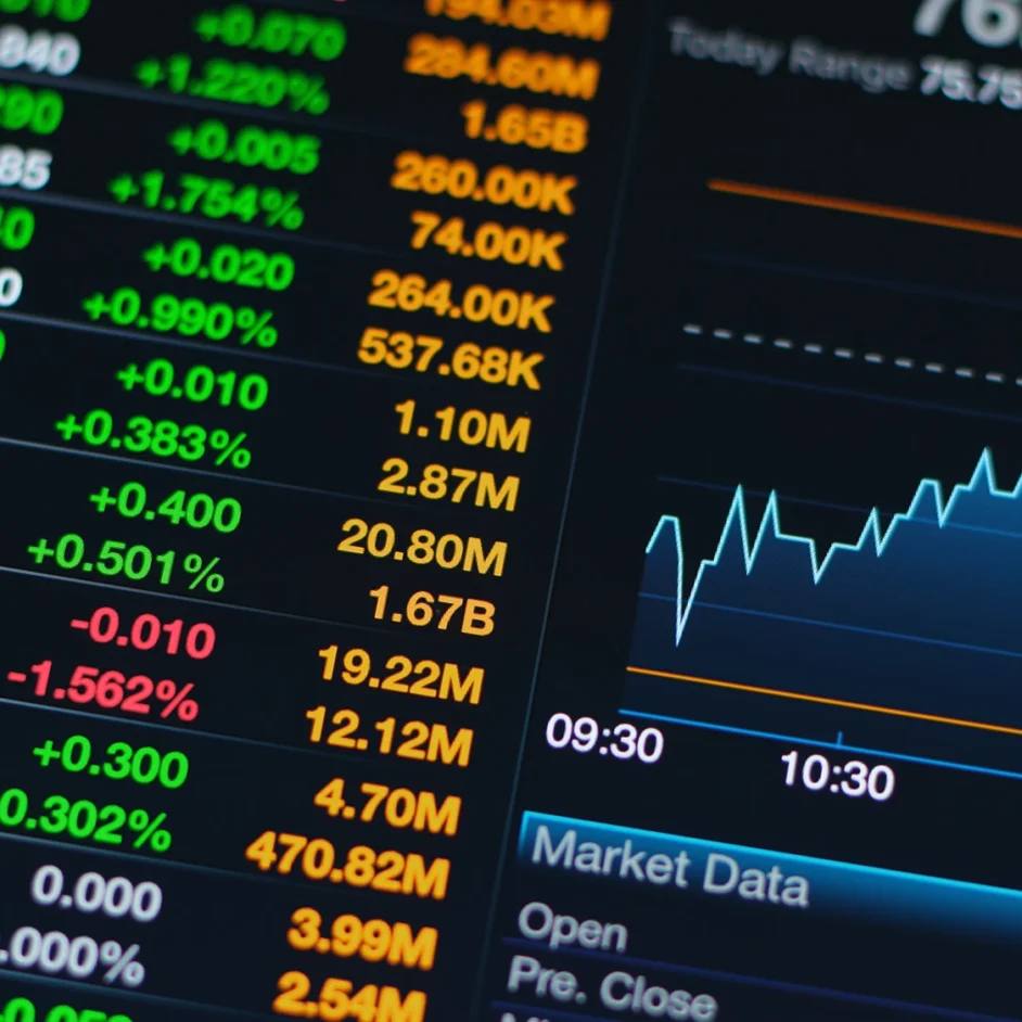 Stock market trading screen displaying various financial data, including graphs, numbers, and market trends.
