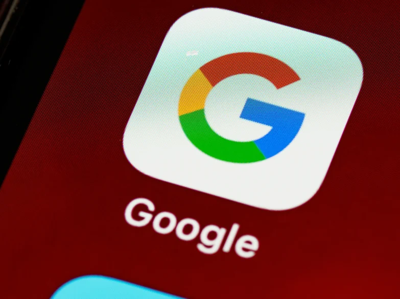 Close up of a smartphone screen with the Google app prominent.