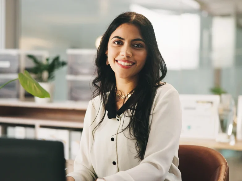 A professional woman sitting at a desk.
