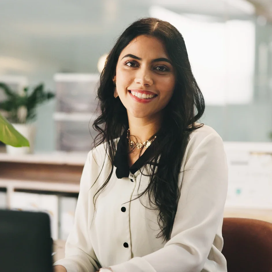 A professional woman sitting at a desk.