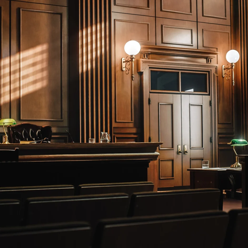A courtroom scene featuring wooden panelling and legal decor.