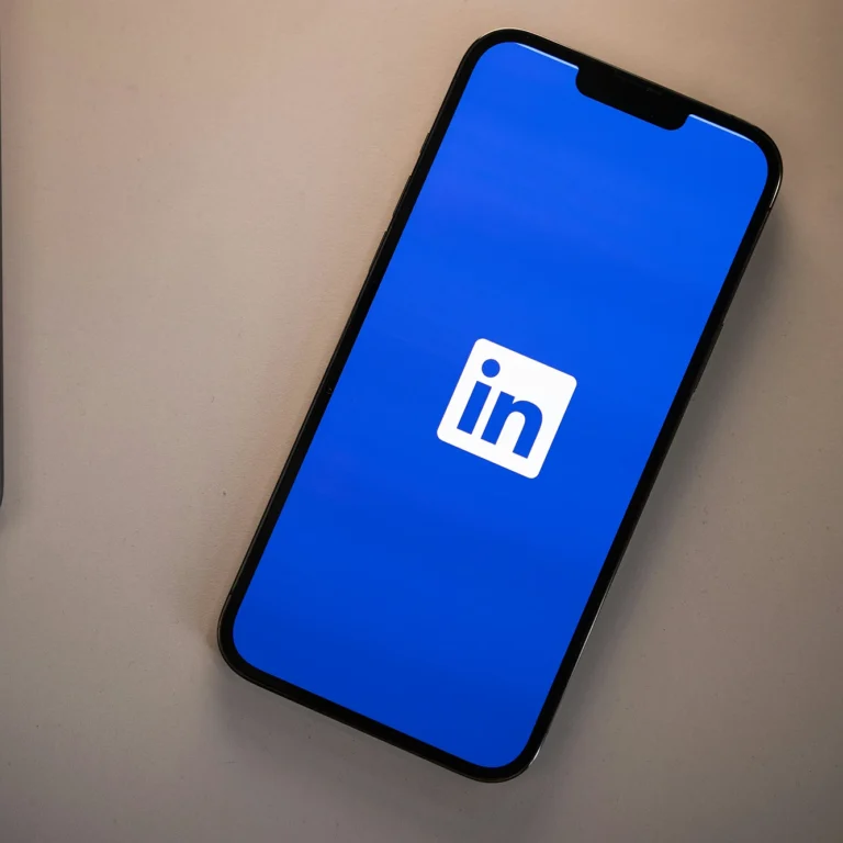 A modern smartphone displaying Linkedin on the screen.