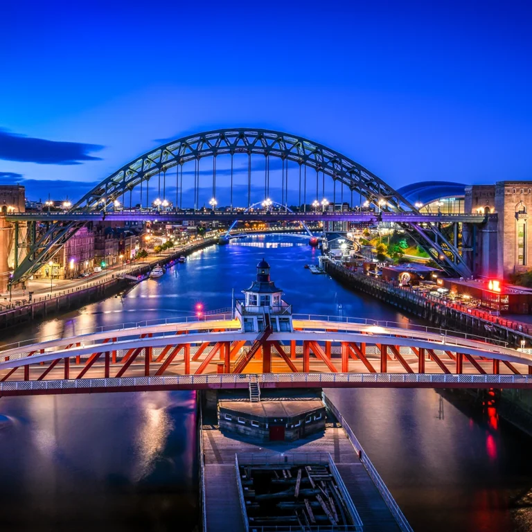 Swing and Tyne Bridges in Newcastle upon Tyne at dusk.