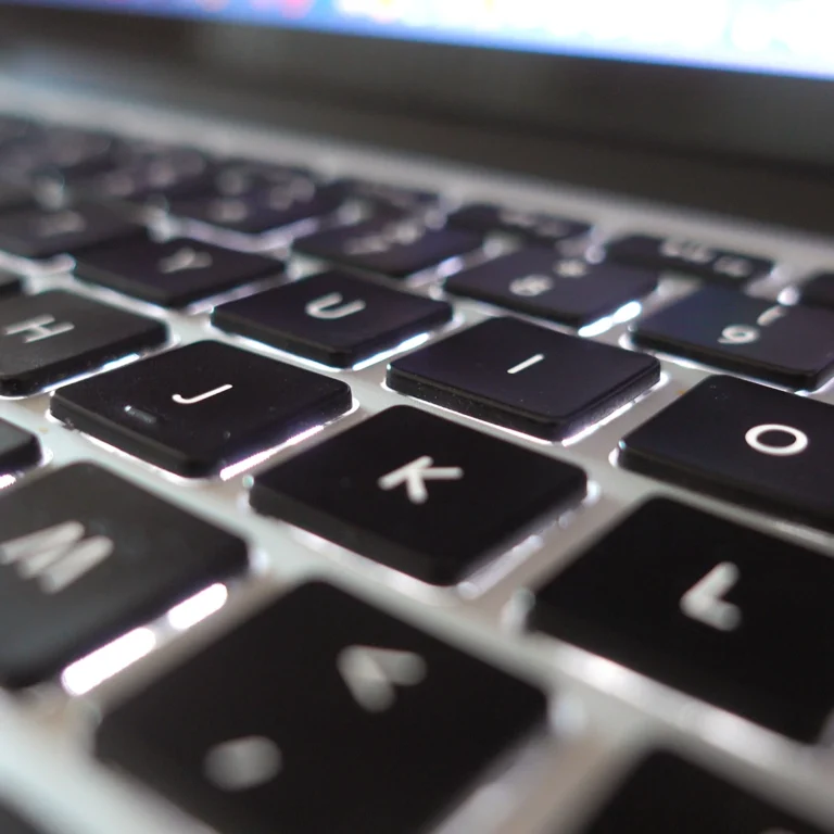 Close-up view of a laptop keyboard, showcasing the keys and their layout in a sleek, modern design.