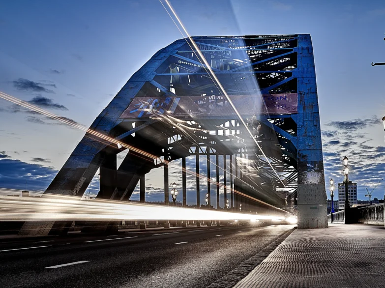 Tyne Bridge at night with car light trails.