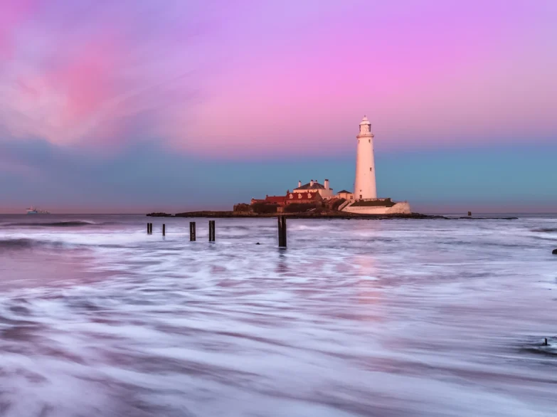St Mary's Lighthouse, Whitley Bay, at dusk with colourful sky.